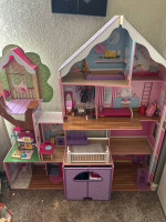 Large Barbie dollhouse mansion with accessories and ambulance