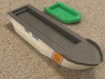 Lego coast guard ship body and a small lego boat
