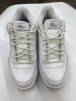 Men’s  Reebok white tie tennis shoes.