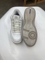 Men’s  Reebok white tie tennis shoes.