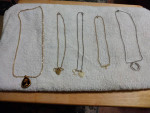 Six pair of ladies shoes and ten custom jewelry necklace