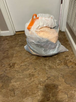 A Bag of Ladies Clothes and Purses