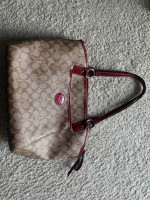 Coach satchel in signature canvas bag with red accents