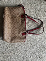 Coach satchel in signature canvas bag with red accents