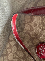 Coach satchel in signature canvas bag with red accents