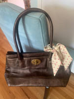 Coach brown leather bag with a bow