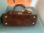 Coach brown leather bag with a bow