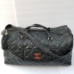 Large Chanel CC style leather duffle travel bag