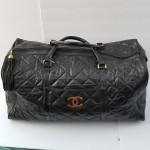 Large Chanel CC style leather duffle travel bag