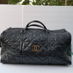 Large Chanel CC style leather duffle travel bag