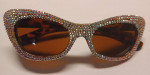 Ladies silver glitter sunglasses, in a-morir bag.