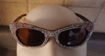 Ladies silver glitter sunglasses, in a-morir bag.