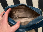 Blue vinyl shoulder bag zipper closure with pockets