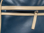 Blue vinyl shoulder bag zipper closure with pockets