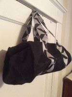 Twelve NYC smaller black Duffel bag. Adjustable shoulder strap.