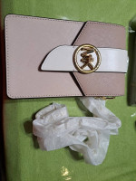 Brand new Michael Kors Crossbody and card holder on back of bag