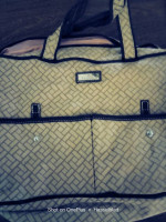Big material carrying purse bag with cmpartments.  Two pictures