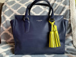 Coach Navy zipper bag with yellow tassel