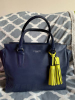 Coach Navy zipper bag with yellow tassel