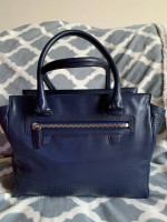Coach Navy zipper bag with yellow tassel