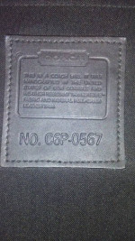 Coach Rolling Suitcase