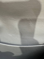 Prada and Louis Vuitton bags