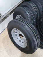 4 NEW 8 LUG TRAILER RIMS AND ST235/80R16 -10 ply radial tires