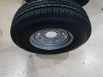 4 NEW 8 LUG TRAILER RIMS AND ST235/80R16 -10 ply radial tires