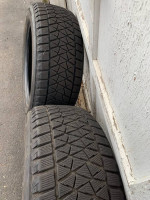 (2) (235/55/18) Bridgestone Blizzak tires with almost full tread