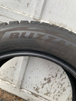 (2) (235/55/18) Bridgestone Blizzak tires with almost full tread