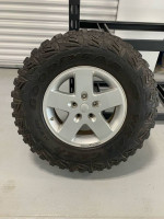 5 Goodyear Kevlar MTR’s (mud terrain) tires with MOAB Jeep wheels