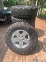 5 Goodyear Kevlar MTR’s (mud terrain) tires with MOAB Jeep wheels