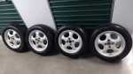 14 inch wheels 4x100 with tires and center caps