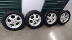 14 inch wheels 4x100 with tires and center caps
