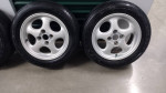 14 inch wheels 4x100 with tires and center caps